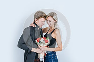 Portrait of happy young couple love together with flower in studio