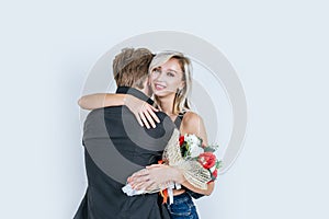 Portrait of happy young couple love together with flower in studio