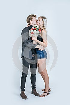 Portrait of happy young couple love together with flower in studio