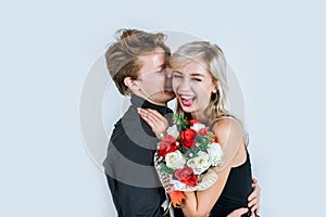 Portrait of happy young couple love together with flower in studio