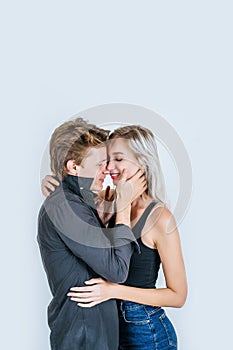 Portrait of happy young couple love together in studio