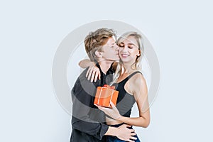 Portrait of happy young couple love together surprise with gift box in studio