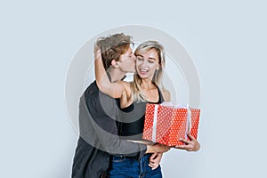 Portrait of happy young couple love together surprise with gift box in studio