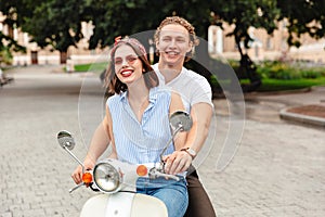 Portrait of a happy young couple riding