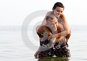 Portrait of a happy young couple in sea