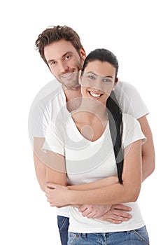 Portrait of happy young couple smiling