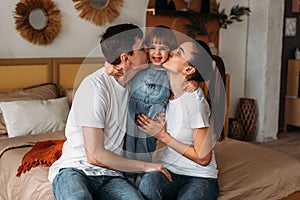 Portrait of a happy young family. Happy child with parents