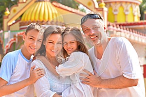 Portrait of happy young family smiling and looking at camera