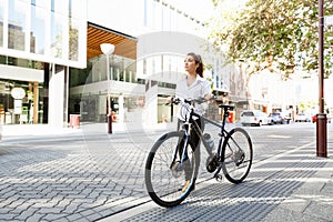 Portrait of happy young female bicyclist