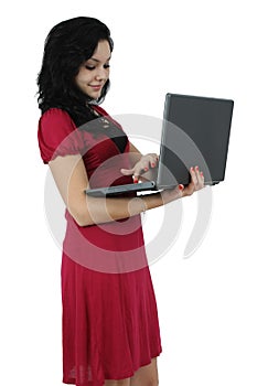 Portrait of a happy young girl with laptop