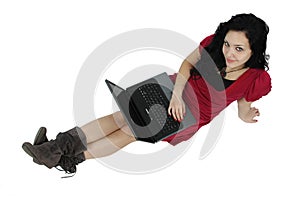 Portrait of a happy young girl with laptop