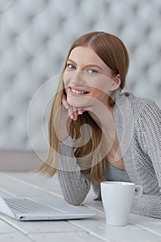 Portrait of a happy young girl with laptop computer