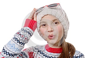 Portrait of a happy young girl snowboarding