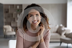 Portrait of happy young Latino woman posing