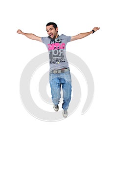 Portrait of a happy young male jumping in air