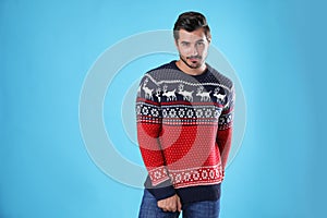 Portrait of happy young man in Christmas sweater