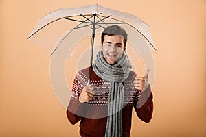 Portrait a happy young man dressed in sweater