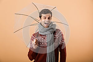 Portrait a happy young man dressed in sweater