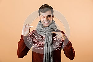 Portrait of a happy young man dressed in sweater