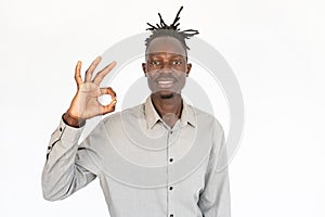 Portrait of happy young man making ok gesture