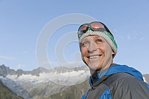 Portrait of a happy young man in the mountains of Switzerland