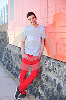 Portrait of a happy young man smiling outdoors