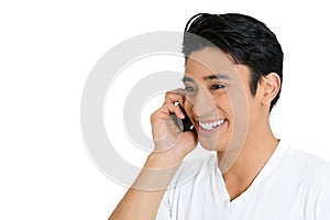 Portrait of a happy young man talking on mobile phone