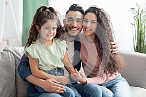 Portrait Of Happy Young Middle Eastern Family Of Three With Little Daughter