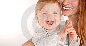 Portrait of a happy young mother near cute baby