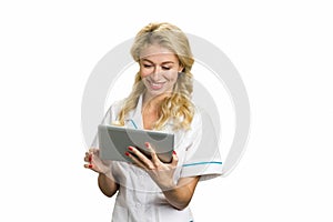 Portrait of happy young nurse with pc tablet.