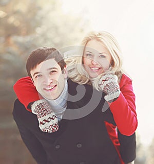 Portrait happy young smiling couple in love having fun at winter day