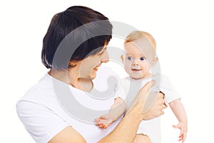 Portrait of happy young smiling father playing with baby on hands