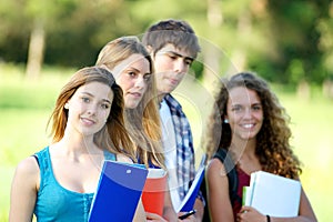 Portrait happy young students in park