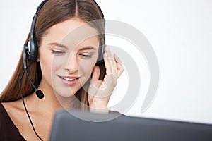 Portrait of happy young support phone operator with headset.