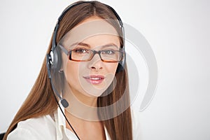 Portrait of happy young support phone operator with headset.