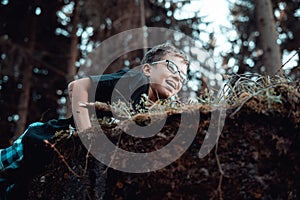 Portrait of happy Young teenager boy climbing