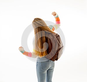 Portrait of happy young teenager student celebrating holidays, end of school or great success