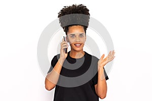 Portrait of happy young woman calling friend on mobile phone