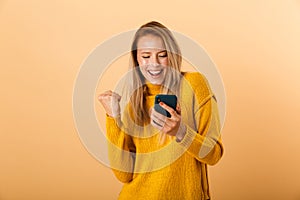 Portrait of a happy young woman dressed in sweater