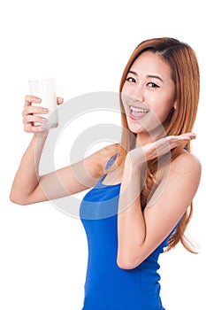 Portrait of happy young woman drinking milk