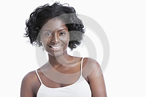 Portrait of happy young woman over white background