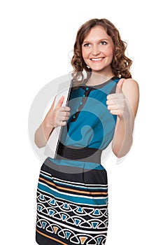 Portrait of a happy young woman posing with a laptop