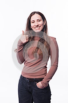 Portrait of happy young woman showing thumb up and smiling