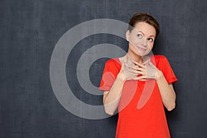 Portrait of happy young woman smiling, imagining something pleasant