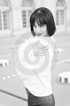 Portrait of happy young woman smiling in paris, france