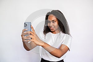 Portrait of happy young woman taking selfie with mobile phone