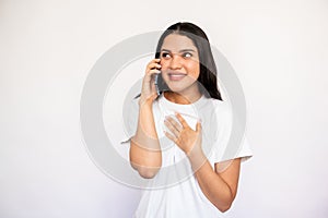 Portrait of happy young woman talking on mobile phone