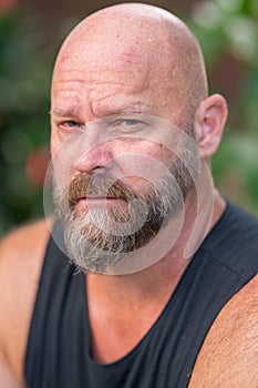 Portrait headshot handsome man staring directly into camera