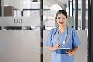 Portrait of healthcare professional holding medical lab patient health check form at hospital.