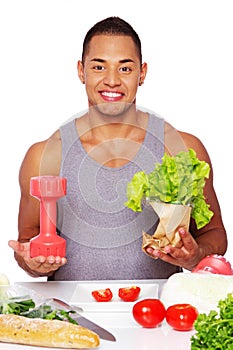 Portrait of healthy man posing in studio with salad
